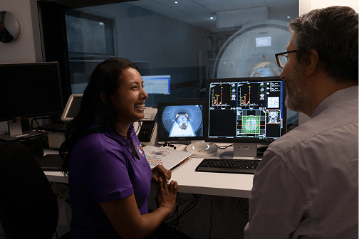 Close-up of wind turbine with field in background